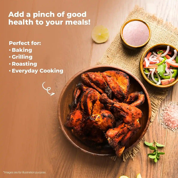 A serving of grilled chicken with vegetables, accompanied by Himalayan Pink Salt, perfect for cooking and seasoning.