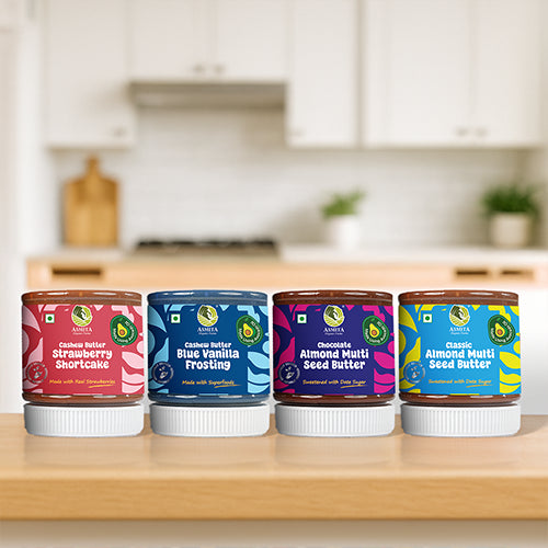 Four jars of different types of nut butters
