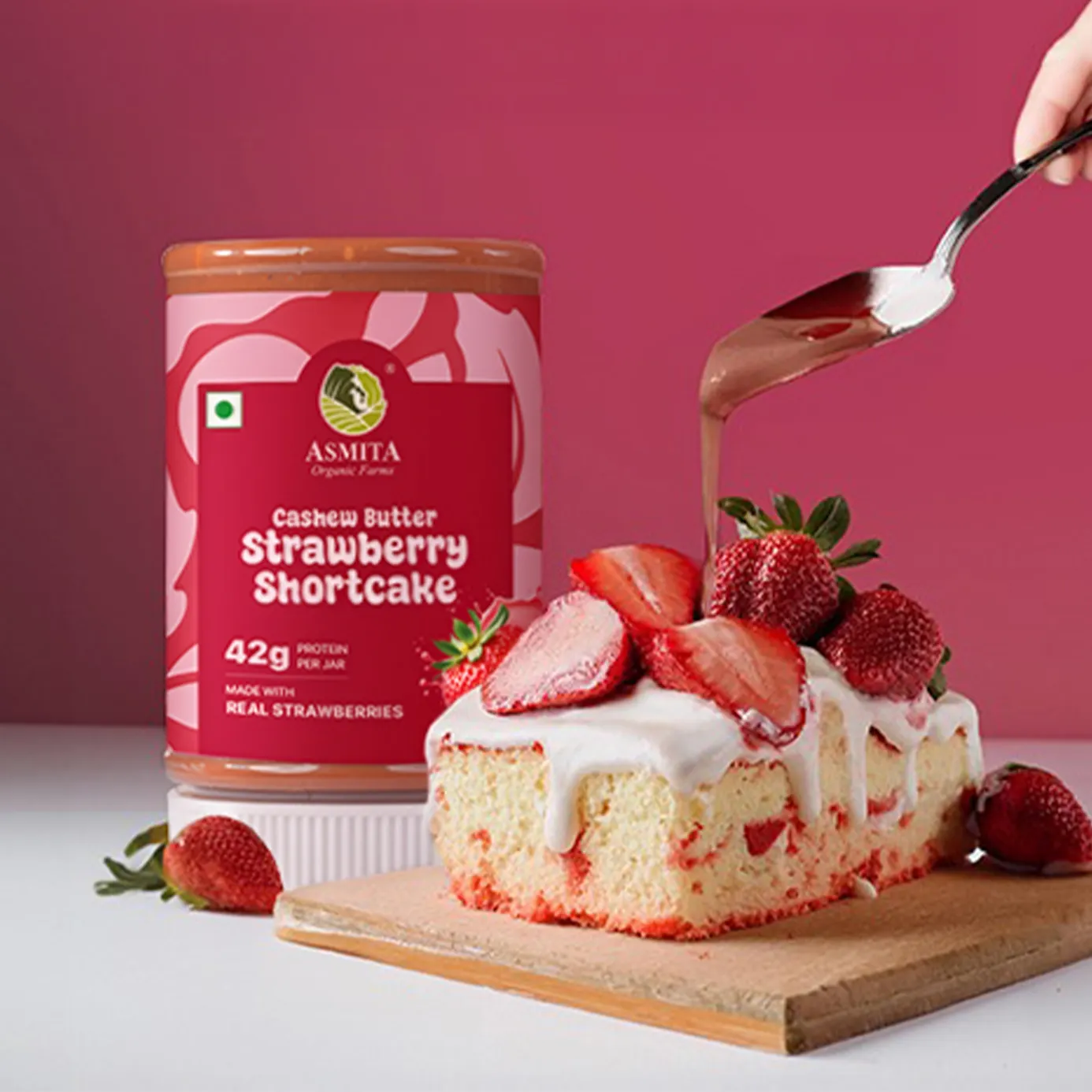 Asmita strawberry shortcake with a jar of Asmita strawberry cashew butter