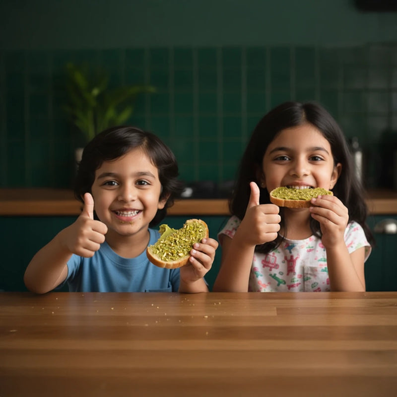 Two children enjoying sandwiches