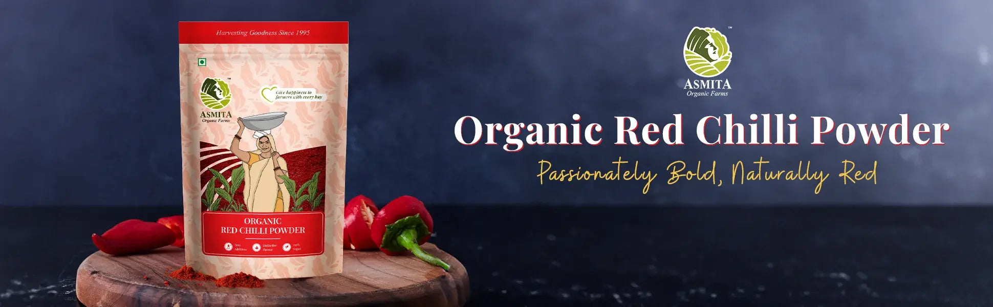  A vibrant display of Asmita Organic Farms' Organic Red Chilli Powder packaging, accompanied by the tagline 