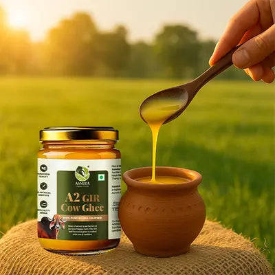 Jar of A2 Gir Cow Ghee with a spoon pouring ghee 