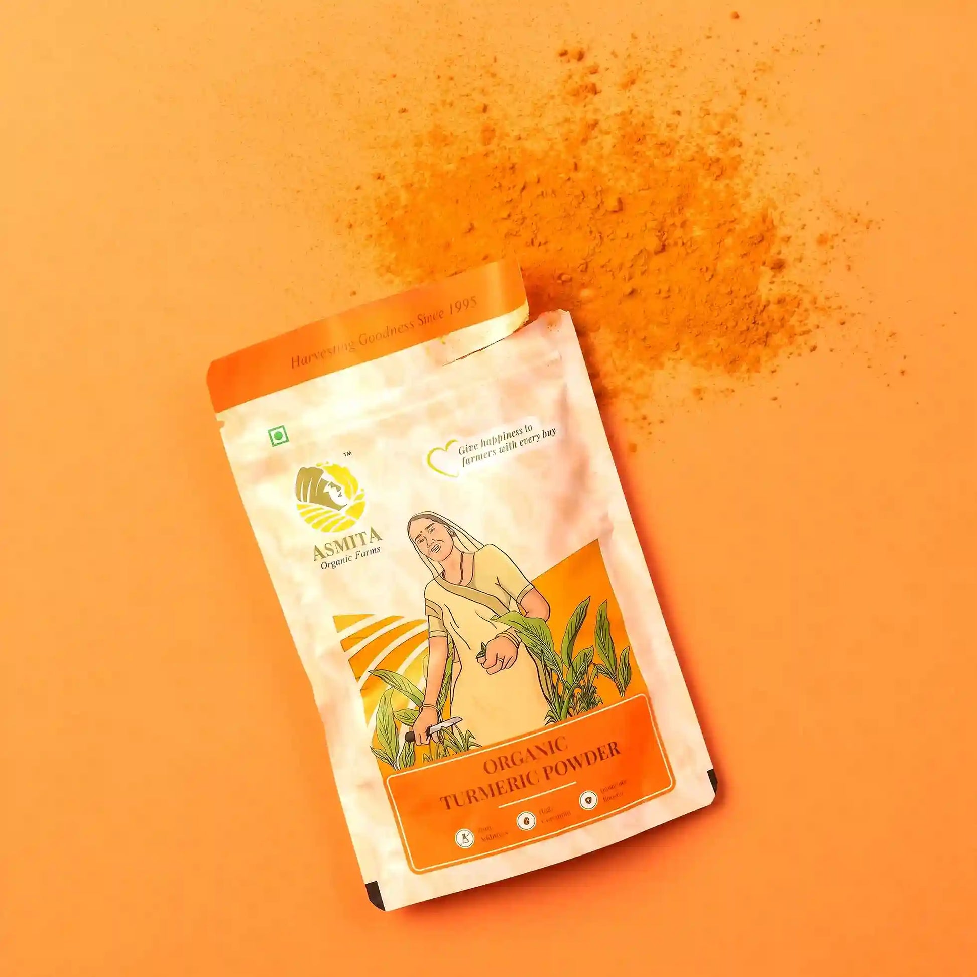 A vibrant display of turmeric powder package with a sprinkle of turmeric powder on an orange background.